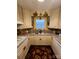 Well-maintained kitchen with custom cabinets, granite countertops, and a decorative backsplash at 406 S Caldwell Ave, Newton, NC 28658