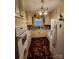 Bright kitchen featuring white cabinets, updated appliances, and a colorful rug at 406 S Caldwell Ave, Newton, NC 28658