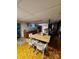 Cozy kitchen with dining area featuring a table with seating, a kitchen area and retro flooring at 406 S Caldwell Ave, Newton, NC 28658