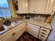 Kitchen corner with granite countertops, stainless steel sink, and mosaic tile backsplash at 406 S Caldwell Ave, Newton, NC 28658