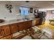 Basement kitchen with stainless steel appliances, window and ample countertop space at 406 S Caldwell Ave, Newton, NC 28658