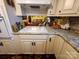 Kitchen featuring modern appliances, granite countertops, and view into living room at 406 S Caldwell Ave, Newton, NC 28658