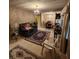 Inviting living room with vintage wallpaper, carpet flooring, and cozy seating at 406 S Caldwell Ave, Newton, NC 28658