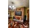 A cozy living room features a brick fireplace, TV, and warm, inviting decor at 406 S Caldwell Ave, Newton, NC 28658