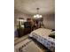 Cozy primary bedroom featuring a four poster bed, carpet and vintage décor at 406 S Caldwell Ave, Newton, NC 28658
