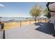Enjoy the lake views from this home's grey deck and experience waterfront living at its finest at 451 S Strand Dr, Norwood, NC 28128