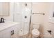 The bathroom features a glass-door shower, modern vanity, and sleek fixtures at 451 S Strand Dr, Norwood, NC 28128