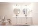 Bright bathroom features double vanity, dual decorative mirrors, and a toilet with bidet at 451 S Strand Dr, Norwood, NC 28128