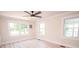 Bright bedroom with multiple windows offering natural light and scenic views at 451 S Strand Dr, Norwood, NC 28128