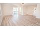 Spacious bedroom with wood floors, door to bathroom, and sliding door access to deck at 451 S Strand Dr, Norwood, NC 28128