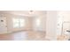 Well-lit bedroom with en-suite bathroom with seamless glass shower at 451 S Strand Dr, Norwood, NC 28128