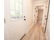 The foyer has beautiful floors and a large front door with a view of the backyard at 451 S Strand Dr, Norwood, NC 28128