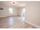 Bright living room with hardwood floors and neutral paint at 451 S Strand Dr, Norwood, NC 28128