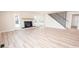 Inviting living room with fireplace, staircase, and plenty of natural light at 451 S Strand Dr, Norwood, NC 28128