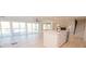 Open living space with water views, modern kitchen, and staircase at 451 S Strand Dr, Norwood, NC 28128