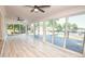 Light-filled sunroom with floor-to-ceiling windows and views of the lake at 451 S Strand Dr, Norwood, NC 28128
