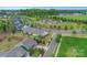 An aerial view showcasing the property's well-maintained lawns and a peaceful, green neighborhood at 504 Gardenbrook Trl, Belmont, NC 28012