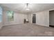A bright and airy bedroom with neutral paint, large windows and a modern chandelier at 504 Gardenbrook Trl, Belmont, NC 28012