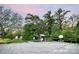 Welcoming entrance to The Conservancy features lush trees and information kiosks for an engaging community experience at 504 Gardenbrook Trl, Belmont, NC 28012