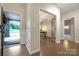 Elegant entryway with hardwood floors leading to a bright office with glass doors at 504 Gardenbrook Trl, Belmont, NC 28012