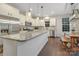 Modern eat-in kitchen featuring stainless steel appliances, granite countertops, a large island, and stylish pendant lighting at 504 Gardenbrook Trl, Belmont, NC 28012