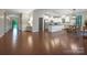 Open-concept living space with hardwood floors, a modern kitchen, and ample natural light at 504 Gardenbrook Trl, Belmont, NC 28012