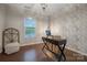 Bright home office with hardwood floors, neutral decor, and a modern desk at 504 Gardenbrook Trl, Belmont, NC 28012
