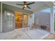 Covered patio with outdoor seating with view of dining area through glass doors at 504 Gardenbrook Trl, Belmont, NC 28012