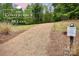 Well-maintained trail with signage, perfect for residents to enjoy outdoor activities and nature walks at 504 Gardenbrook Trl, Belmont, NC 28012