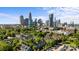 Apartment complex surrounded by trees with skyline view at 505 N Graham St # 2H, Charlotte, NC 28202