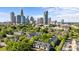 Apartment complex surrounded by trees with skyline view at 505 N Graham St # 2H, Charlotte, NC 28202
