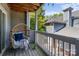 Inviting balcony with a comfortable egg chair and string lights, offering a relaxing outdoor space at 505 N Graham St # 2H, Charlotte, NC 28202