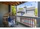 Inviting balcony with a comfortable egg chair and string lights, offering a relaxing outdoor space at 505 N Graham St # 2H, Charlotte, NC 28202