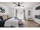 Bright bedroom with ample natural light, a ceiling fan, wood floors, and tasteful decor at 505 N Graham St # 2H, Charlotte, NC 28202
