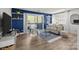 Comfortable living room showcasing a balcony, stylish decor, and an inviting seating arrangement at 505 N Graham St # 2H, Charlotte, NC 28202