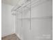 Organized walk-in closet featuring adjustable shelving, providing ample storage space at 505 N Graham St # 2H, Charlotte, NC 28202