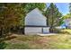 Backyard featuring construction and concrete patio, surrounded by mature trees at 505 S South St, Gastonia, NC 28052
