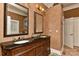 Bathroom featuring dual sinks, granite countertop, and large framed mirrors at 505 S South St, Gastonia, NC 28052