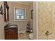Charming bathroom features an ornate vanity, tiled shower and flooring at 505 S South St, Gastonia, NC 28052