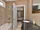 Bathroom with a stylish granite countertop and a shower/tub combo at 505 S South St, Gastonia, NC 28052