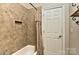 Bathroom featuring tiled walls and floors, a shower with a curtain, and a recessed shelf at 505 S South St, Gastonia, NC 28052