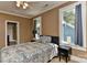 Cozy bedroom features a comfortable bed and natural light from dual windows at 505 S South St, Gastonia, NC 28052