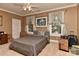 Neutral bedroom with a large bed and moving boxes, illuminated by natural light at 505 S South St, Gastonia, NC 28052