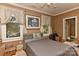 Bedroom with furniture and boxes, filled with natural light from large windows at 505 S South St, Gastonia, NC 28052