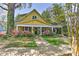 Charming yellow two-story home with a welcoming front porch and well-maintained landscaping at 505 S South St, Gastonia, NC 28052