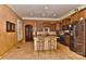 Bright kitchen with an island, stainless steel appliances, tiled floors, and a view to the living room at 505 S South St, Gastonia, NC 28052