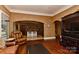 Inviting living room open to the kitchen through an arched doorway, with hardwood floors at 505 S South St, Gastonia, NC 28052