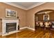 Elegant living room featuring a decorative fireplace, hardwood floors, and classic detailing at 505 S South St, Gastonia, NC 28052
