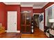 Office space featuring hardwood floors, large cabinet, and doorway with natural light at 505 S South St, Gastonia, NC 28052