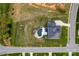Aerial view of a landscaped property featuring a custom pool, spa, covered patio, and play area at 5051 Hyannis Ct, Matthews, NC 28104